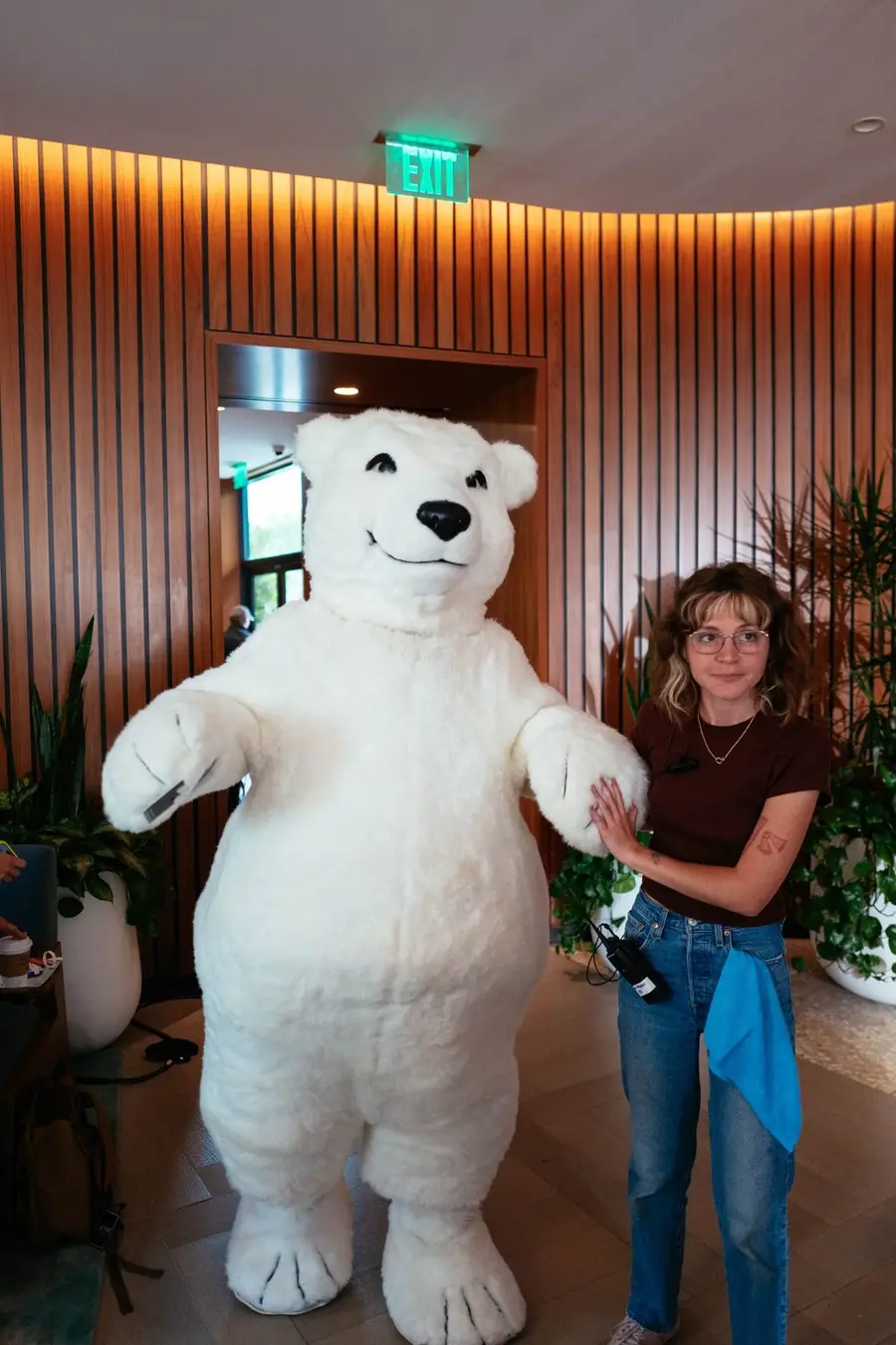 Coca-Cola polar bear on set with a crew member