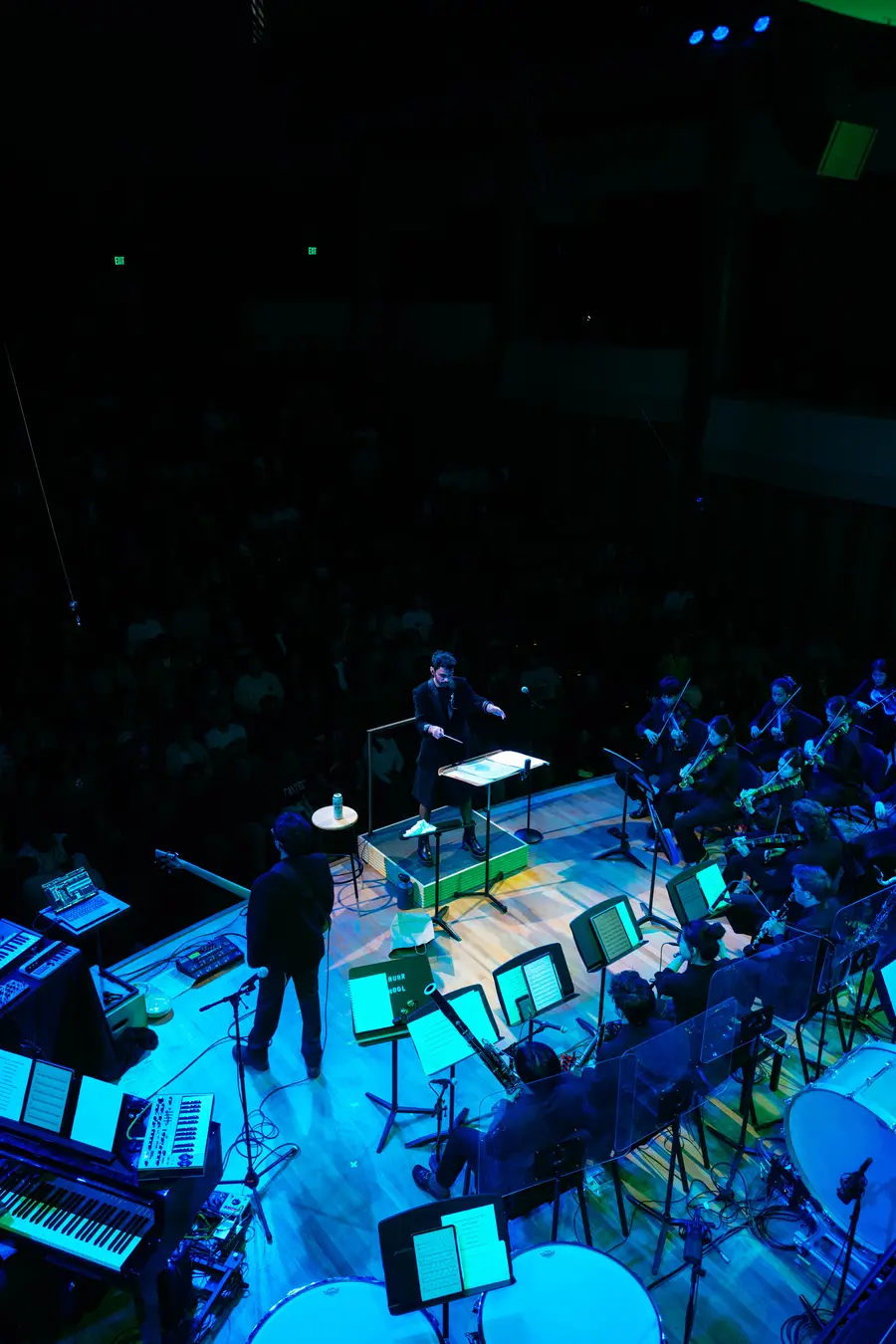 Overhead view of the orchestra under blue light