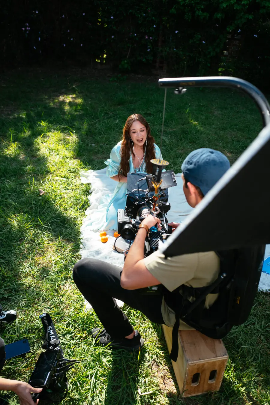 Over the camera operator’s shoulder on the garden set